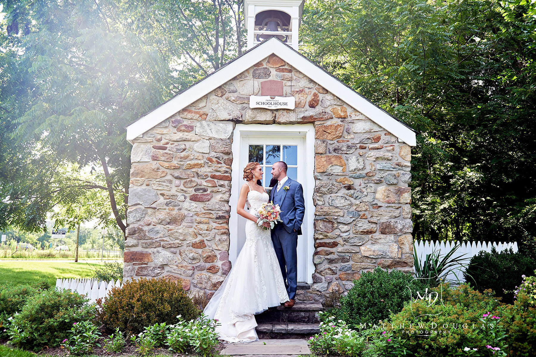 Bride and groom at the school house at The Farmhouse at The Grand Colonial