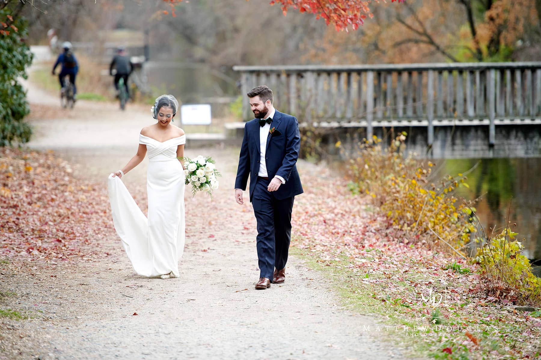 bride and groom walking on the lambertville towpath photo