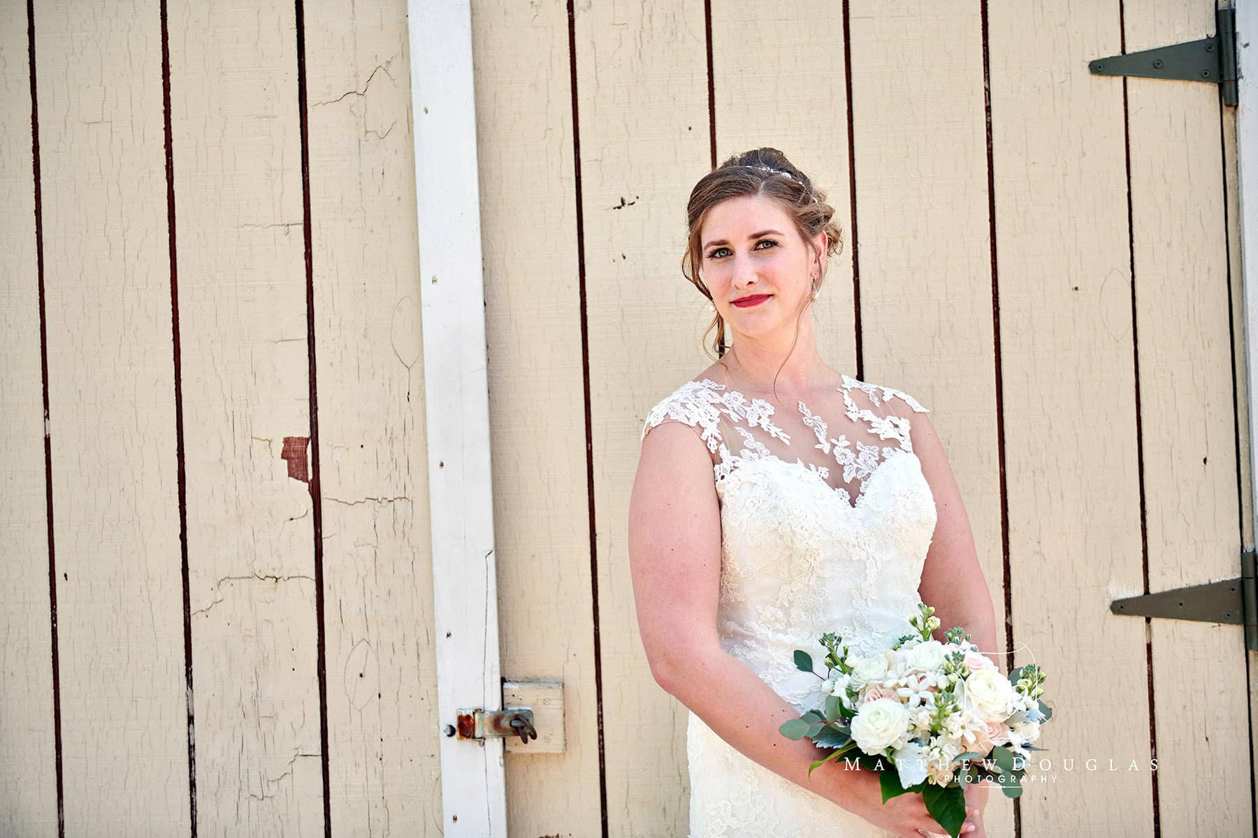 bride and old barn