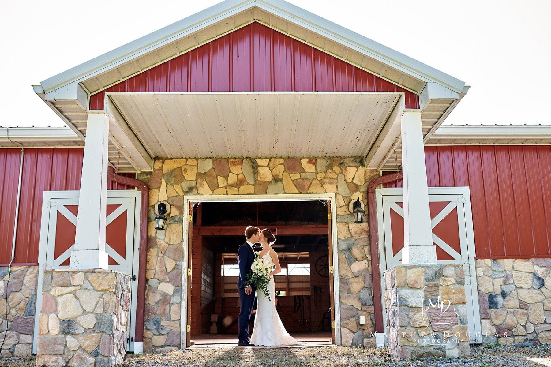 bride and groom in a barn photo