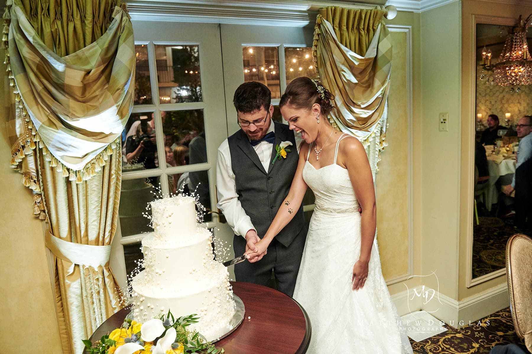 olde mill inn wedding cake cutting photo