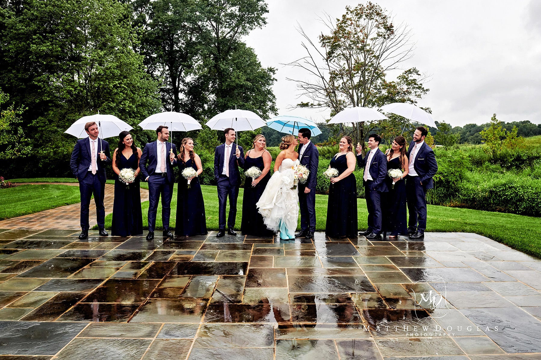rainy day wedding bridal party photo