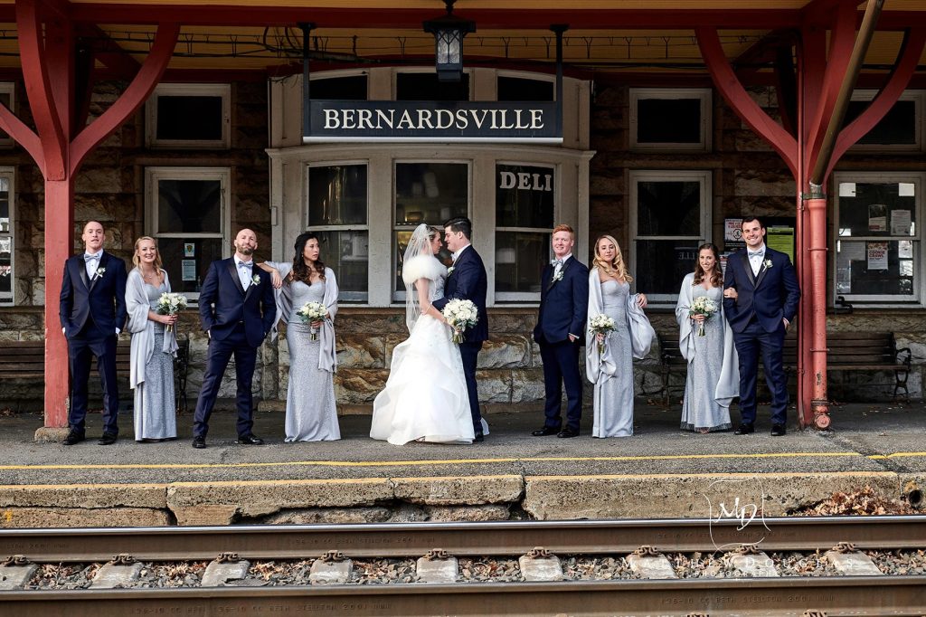 bernards inn winter wedding cori steven 04 bridal party photo at bernardsville train station