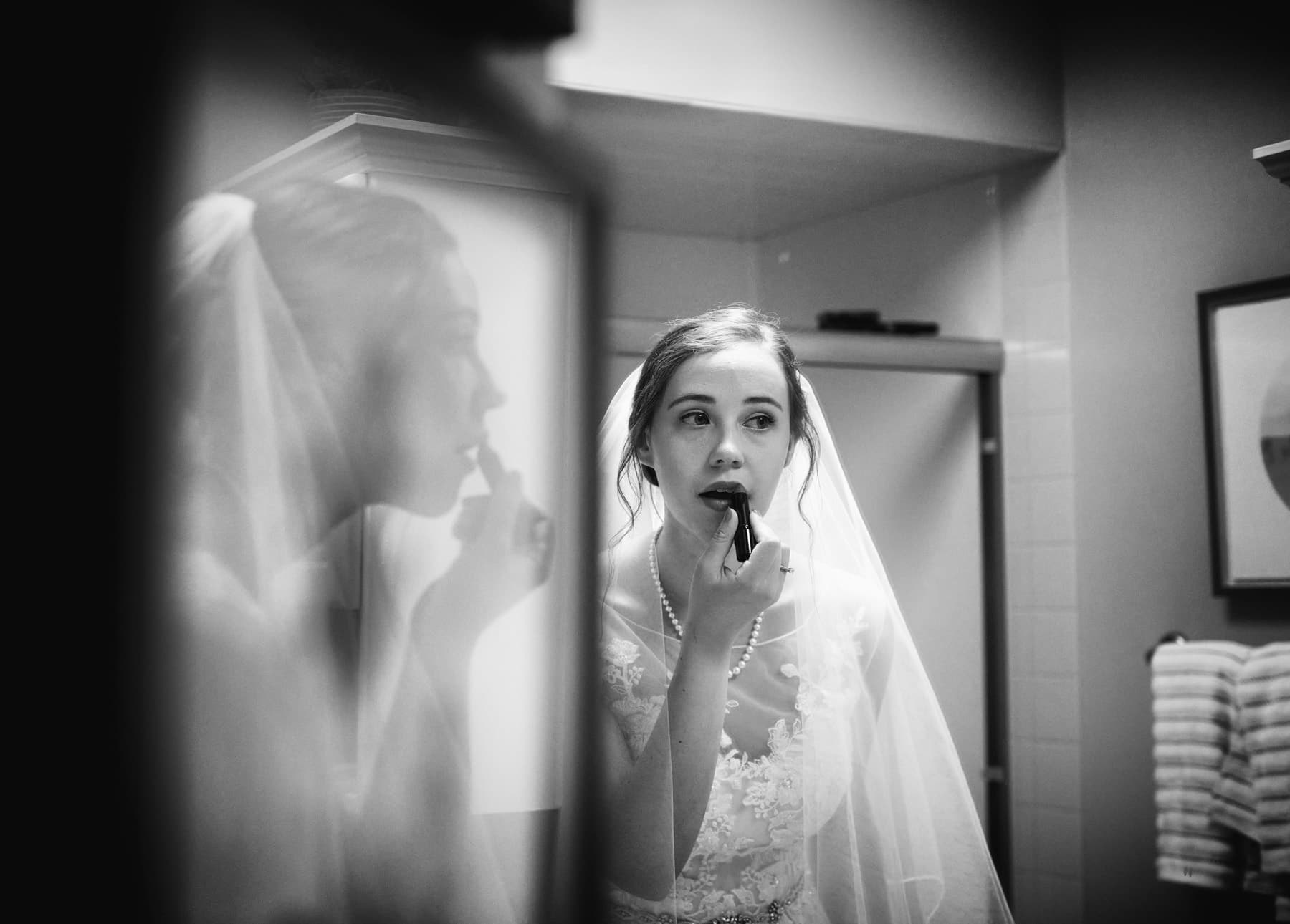 B+W photo of bride getting ready