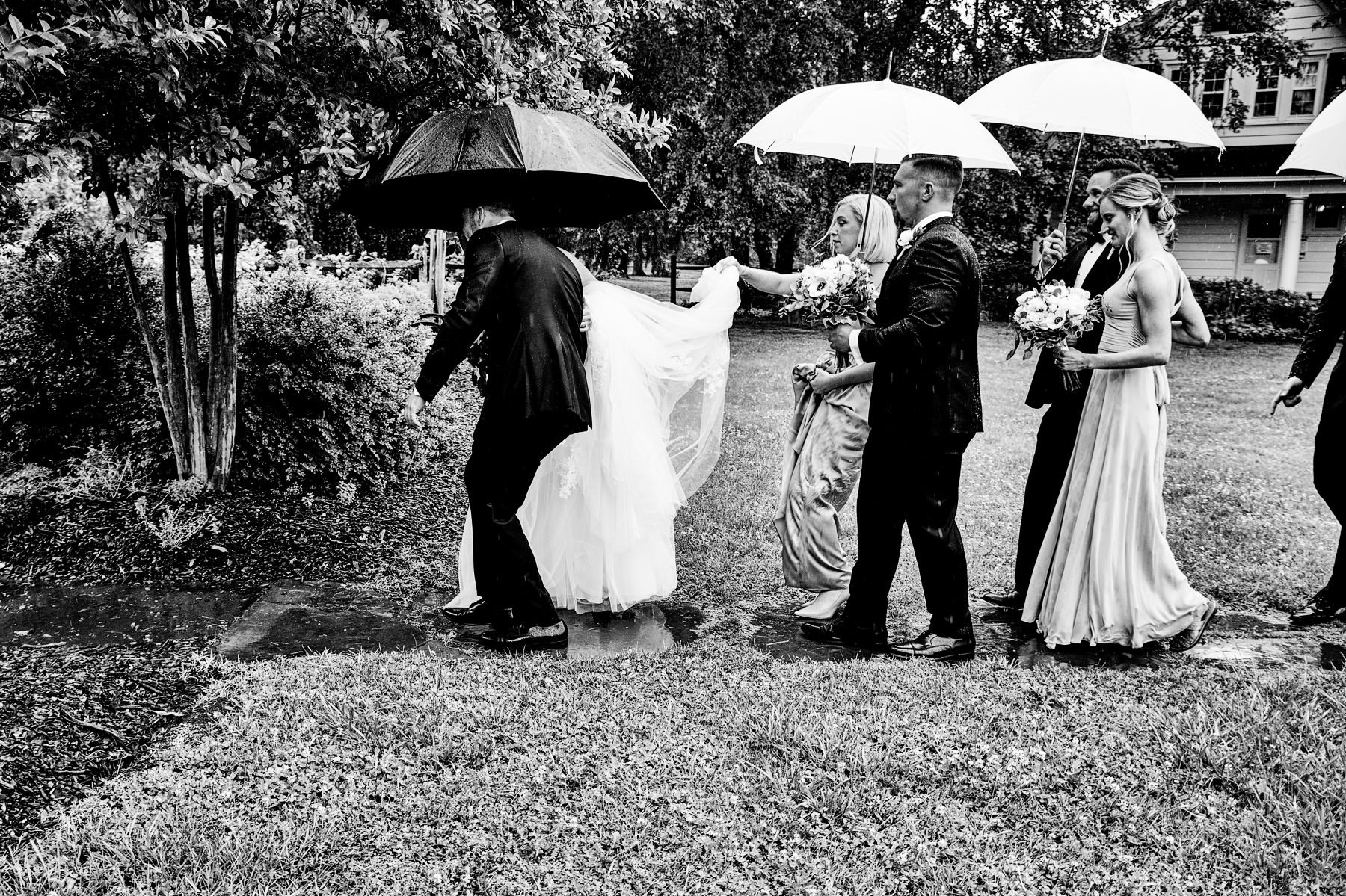 bridal party walking in the rain