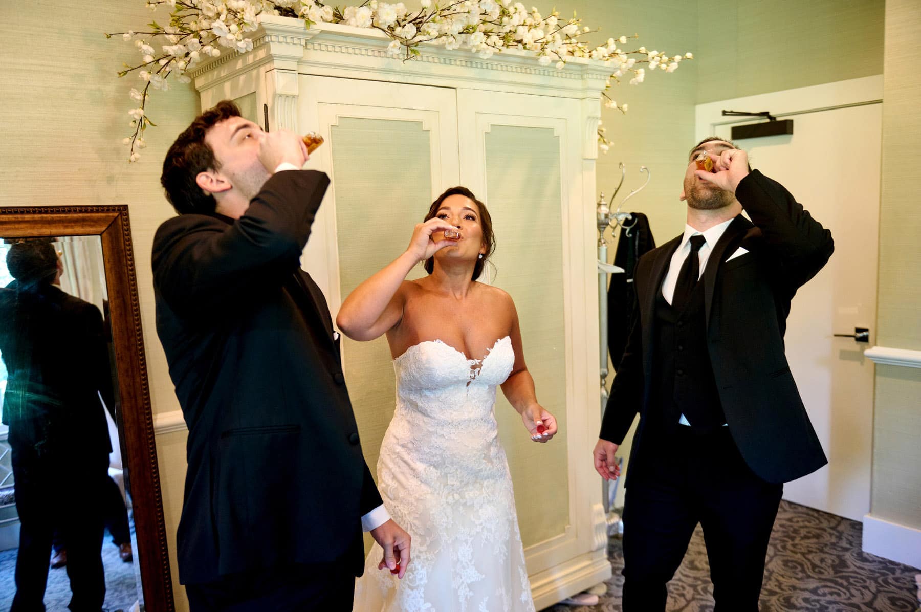 bride doing shots at The Farmhouse