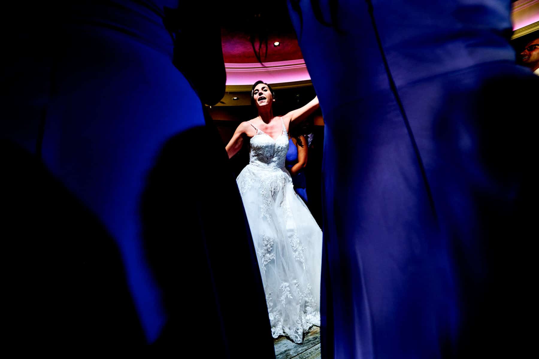 bride dancing with her bridesmaids at The Farmhouse