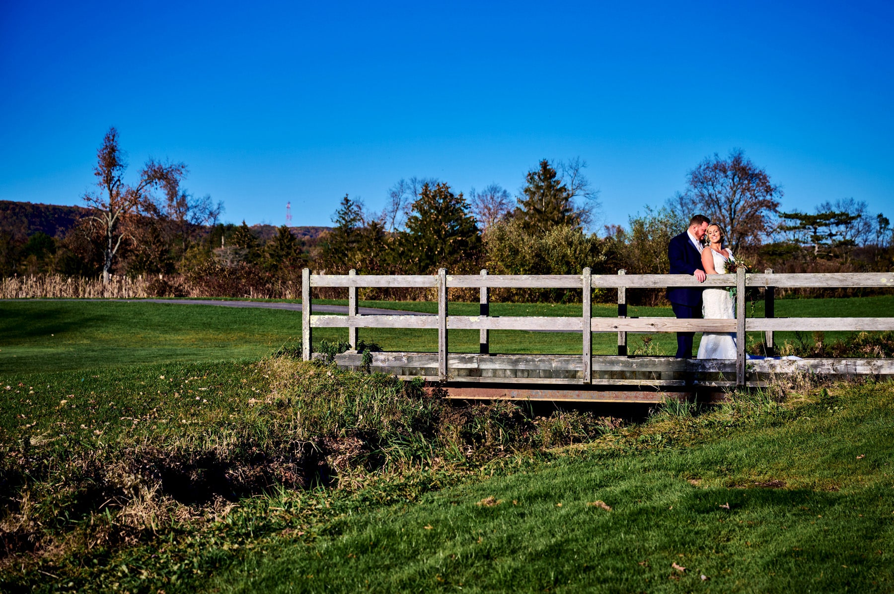 wedding photo on the bridge at Chandelier at Flanders Valley