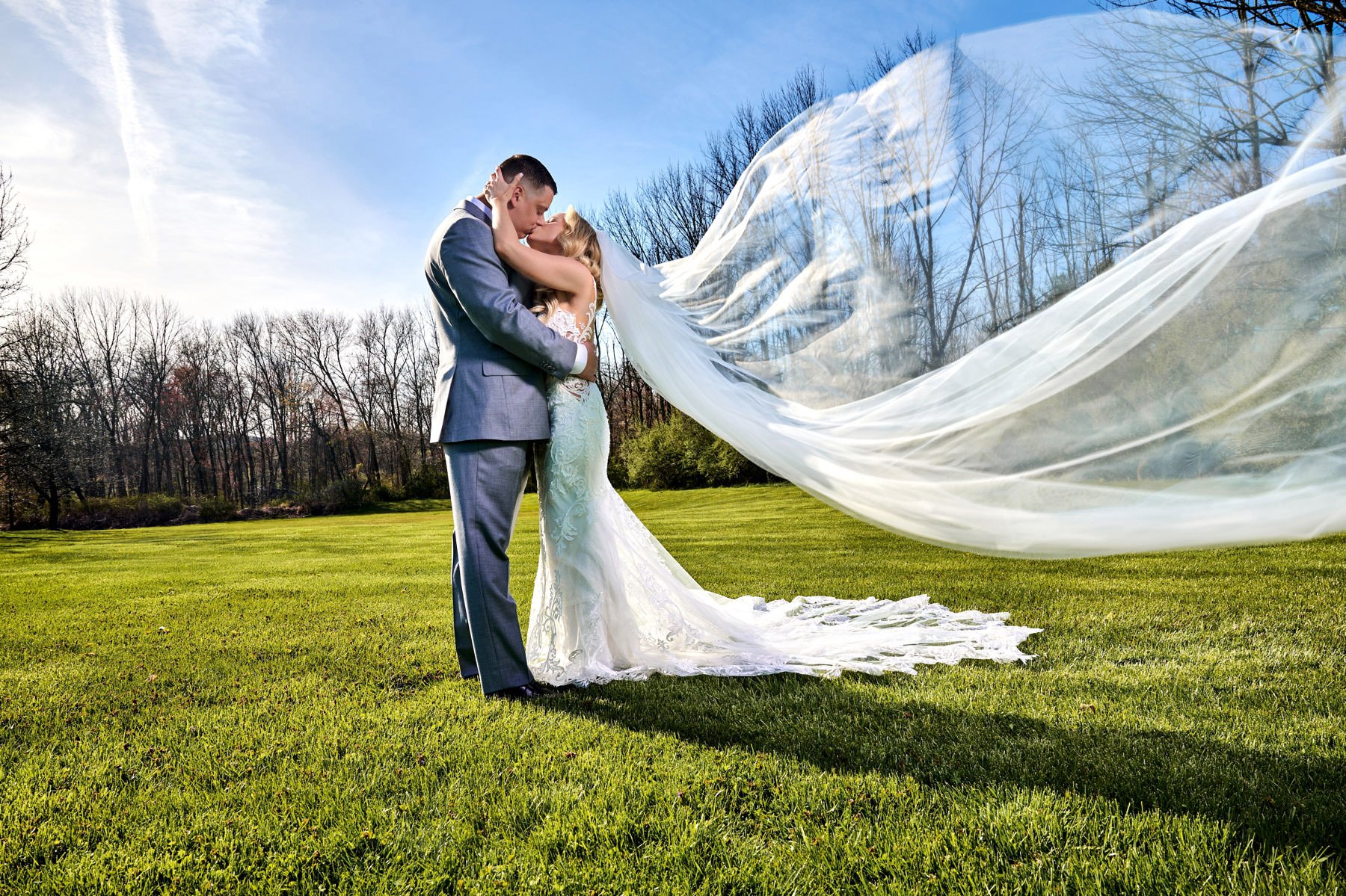 the brides veil blowing in the wind