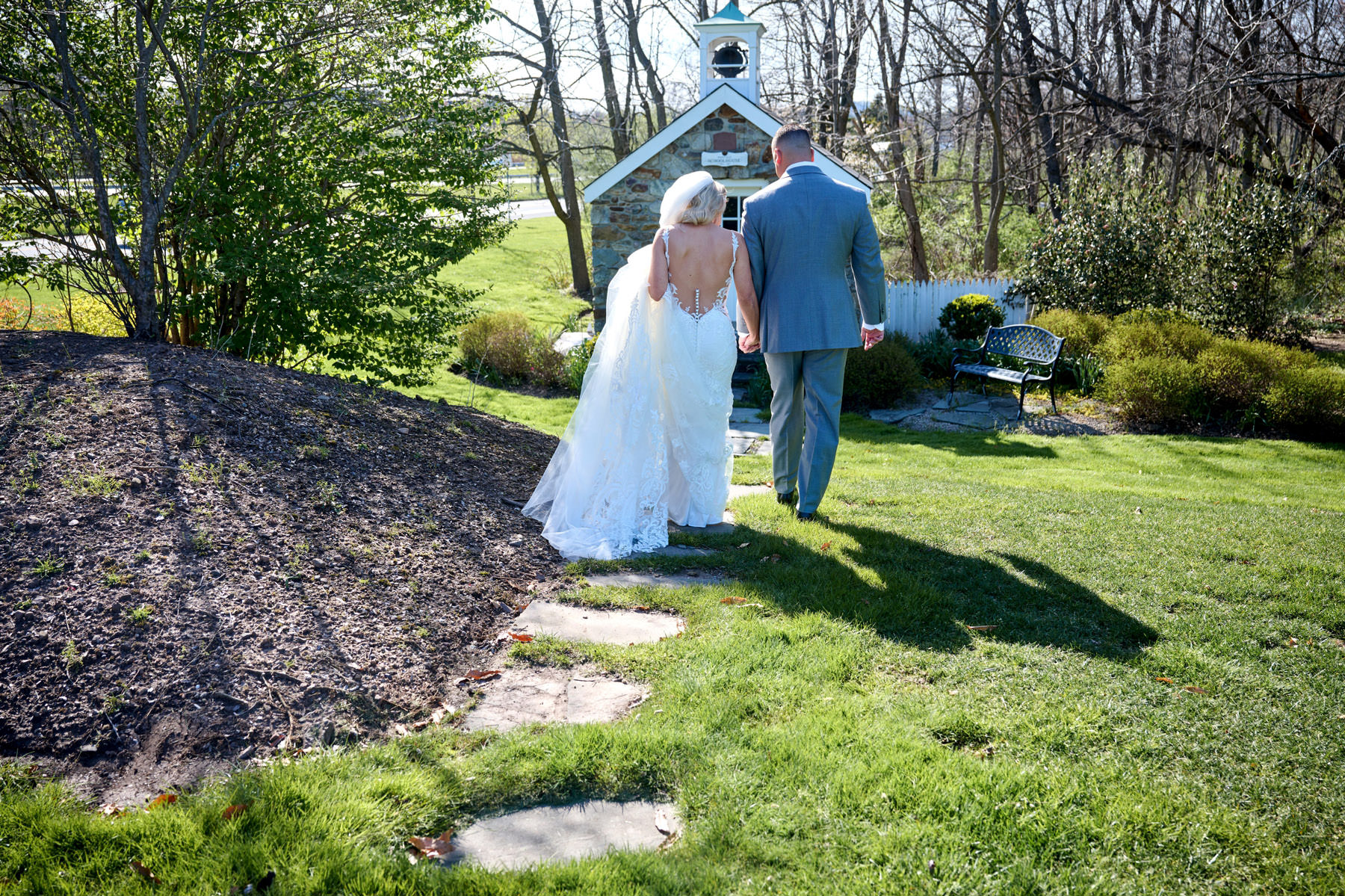 bride and groom walking hand in hand