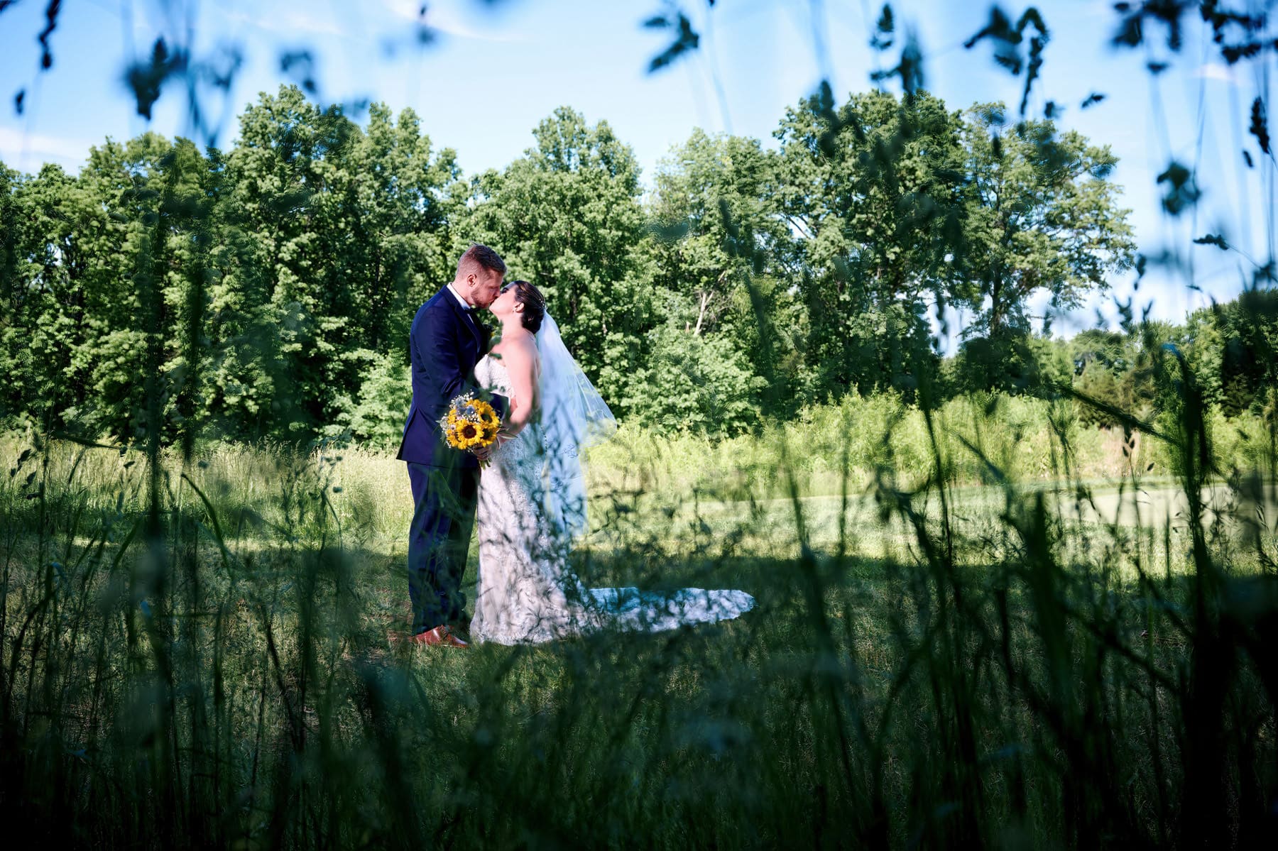 bride and groom kissing at Royce Brook country club