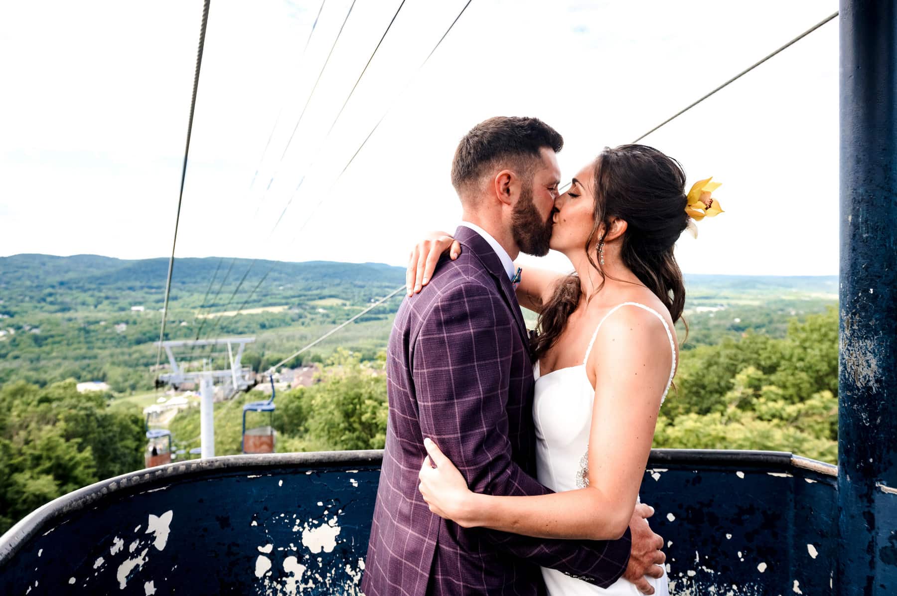 bride and groom kissing in the gondola at Mountain Creek Resort