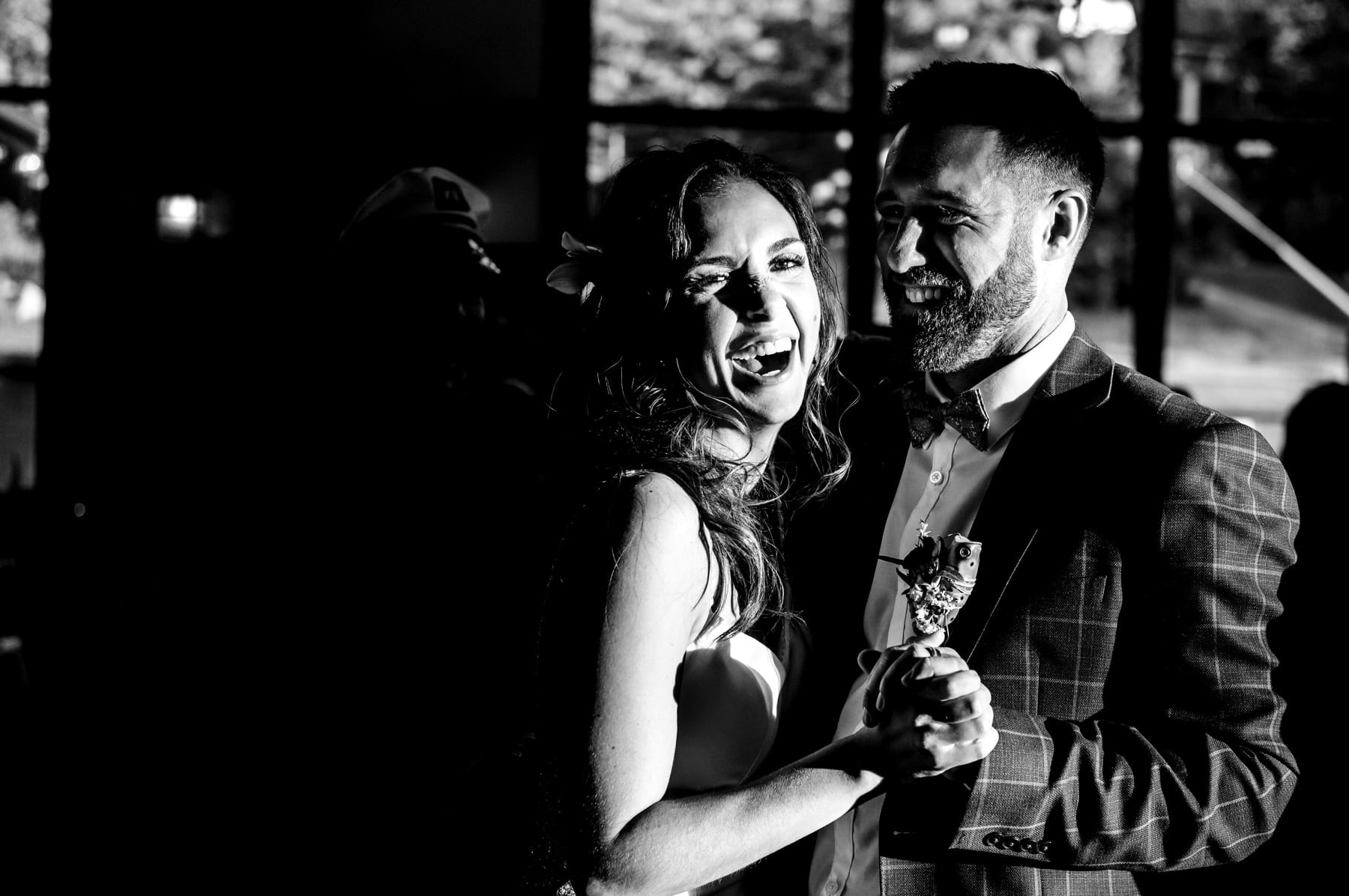 bride and groom dancing and laughing at Mountain Creek Resort