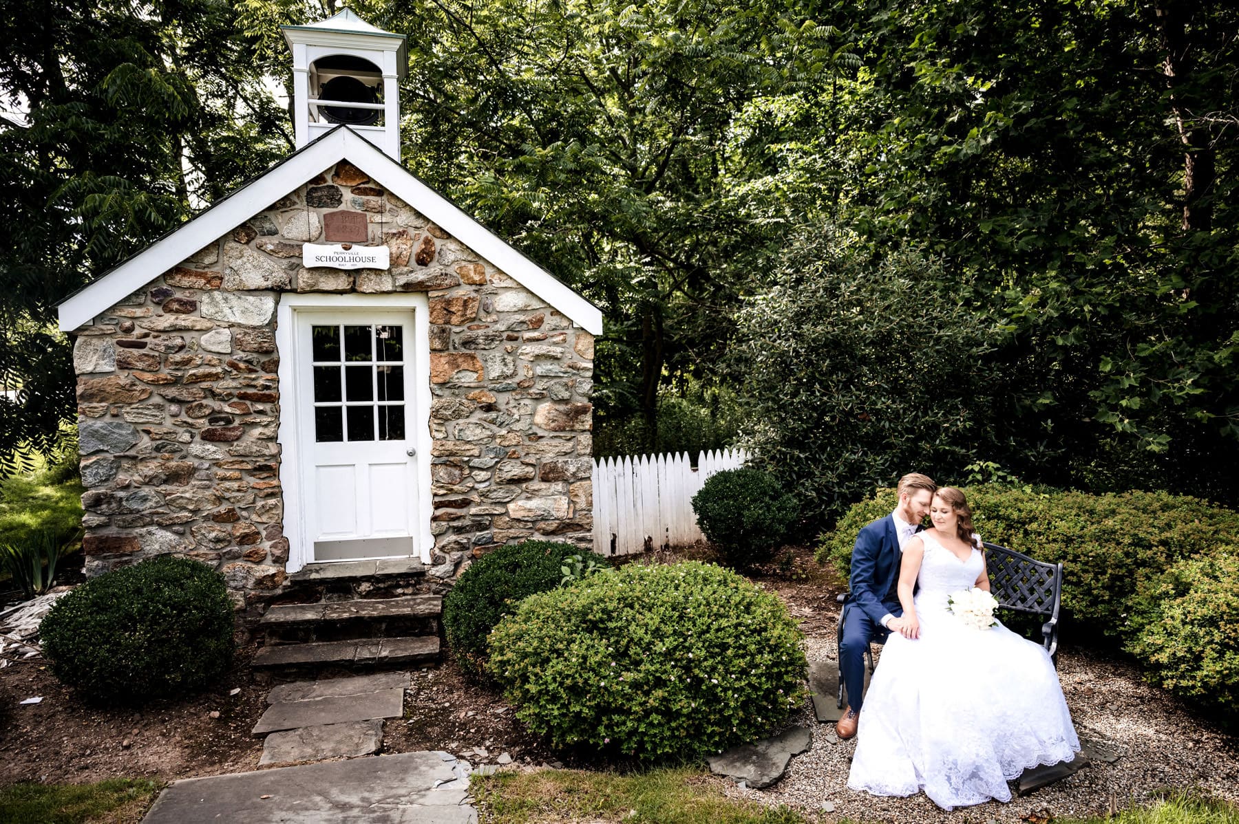 bride and groom by the schoolhouse at The Farmhouse in Hampton NJ on their wedding day