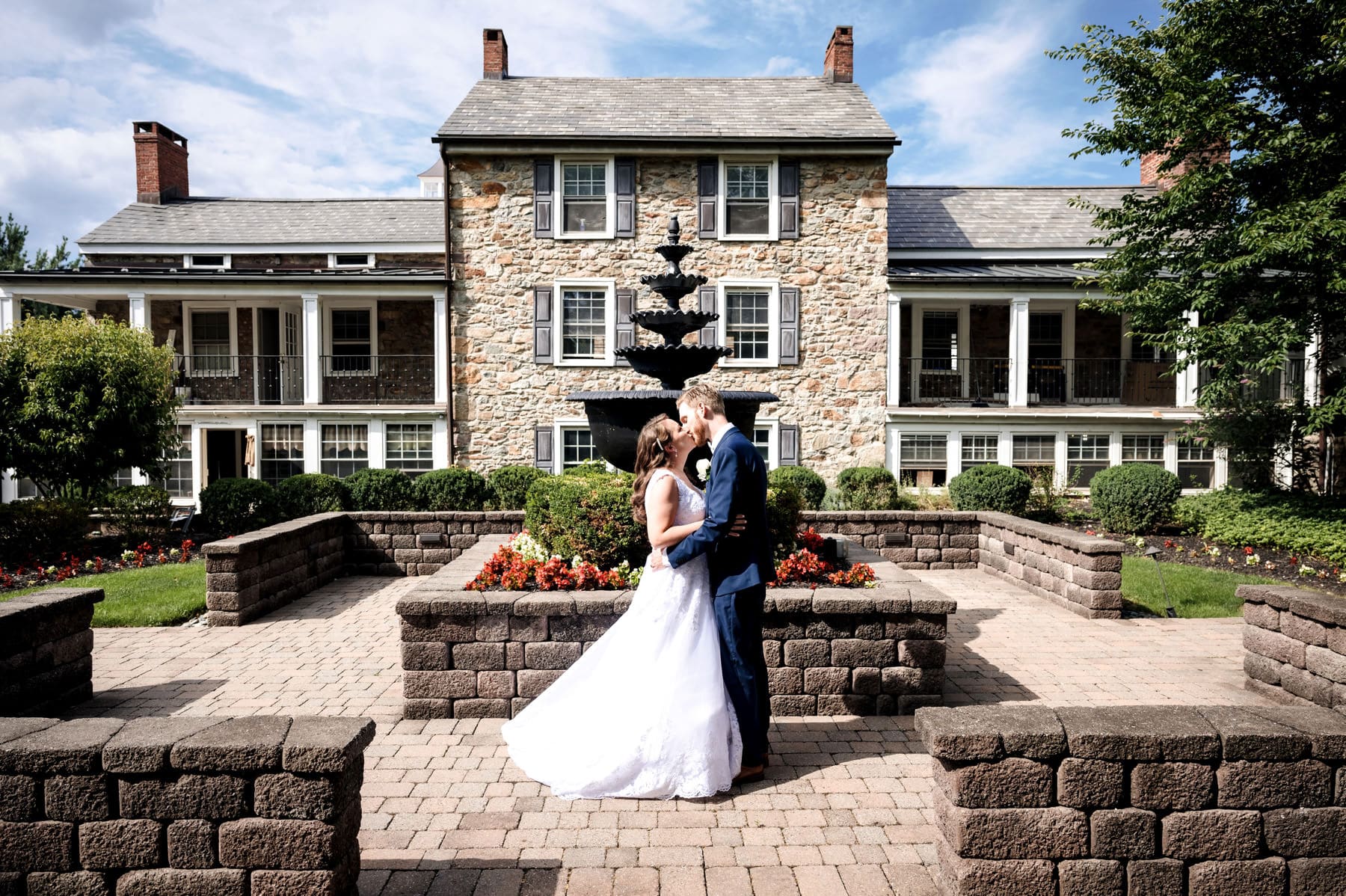 wedding photo in front of the historic Farmhouse wedding venue in NJ