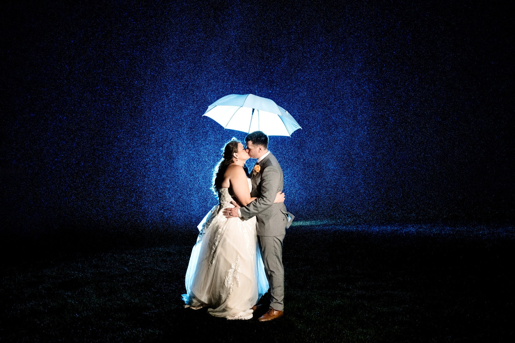 rainy night time wedding portrait at Sandy Hook Chapel